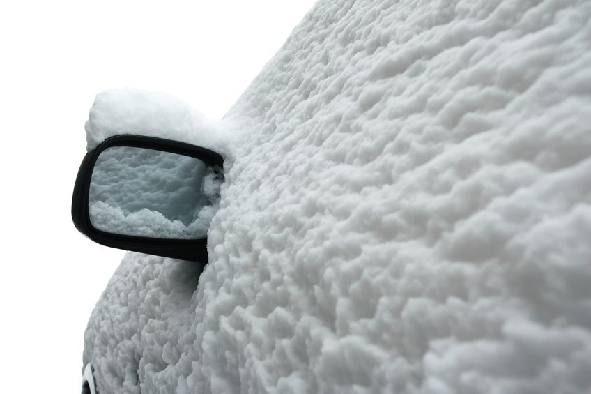 17858281 - side view of a car in winter after snow storm isolated on white background the whole car is covered with snow