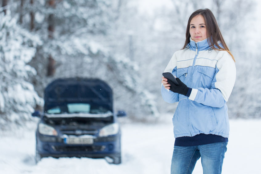50565189 - winter car breakdown - woman call for help.